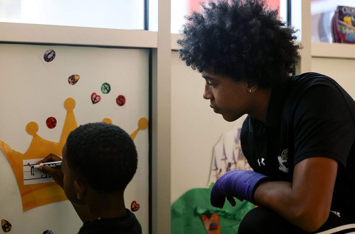 Josiah Hall, 16, a junior at Ben Barber Innovation Academy, helps pre-K student Saint Bishop write his name while interning at Jandrucko Early Learners Academy on Thursday, Nov. 6, 2025.